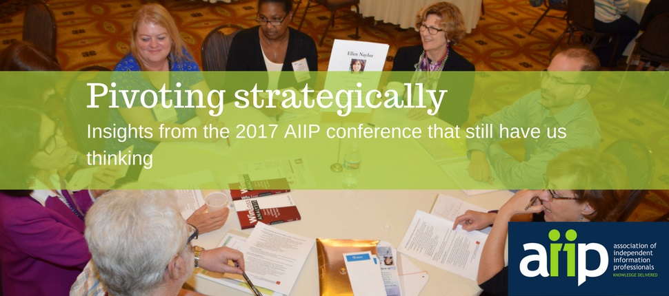 participants at AIIP's 2017 conference in discussion around a table